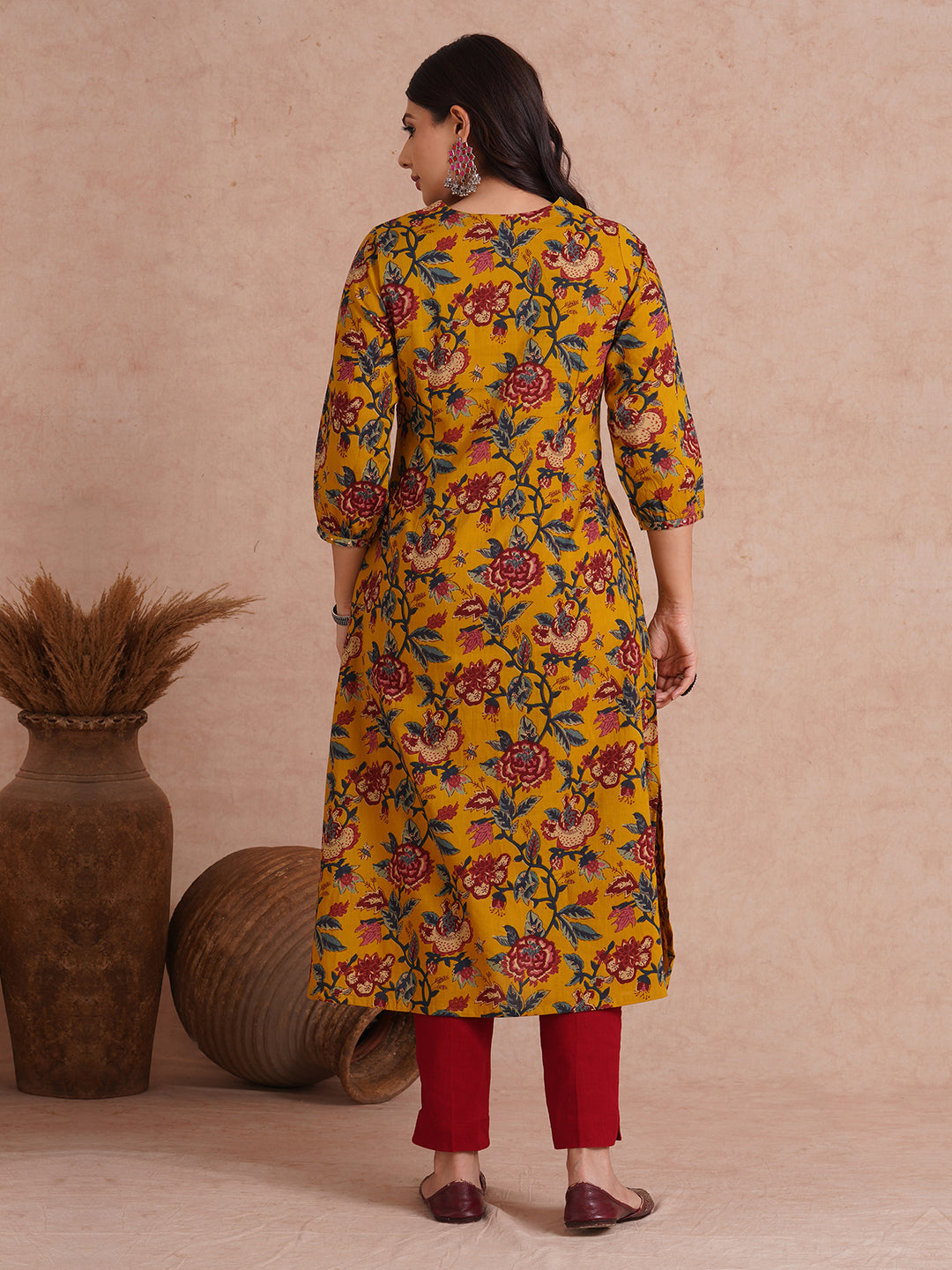 A-Line cotton print kurta with couching lines, sequin work, puffed sleeves and a pocket.