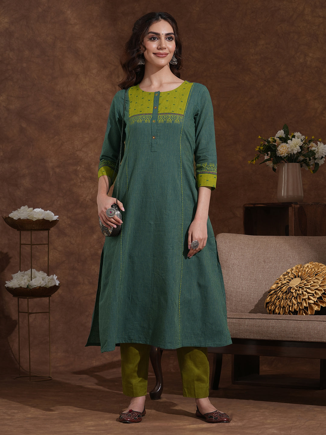 Pocketed A-line kurta in woven stripe cotton with a dobby trim and handwork detailing.