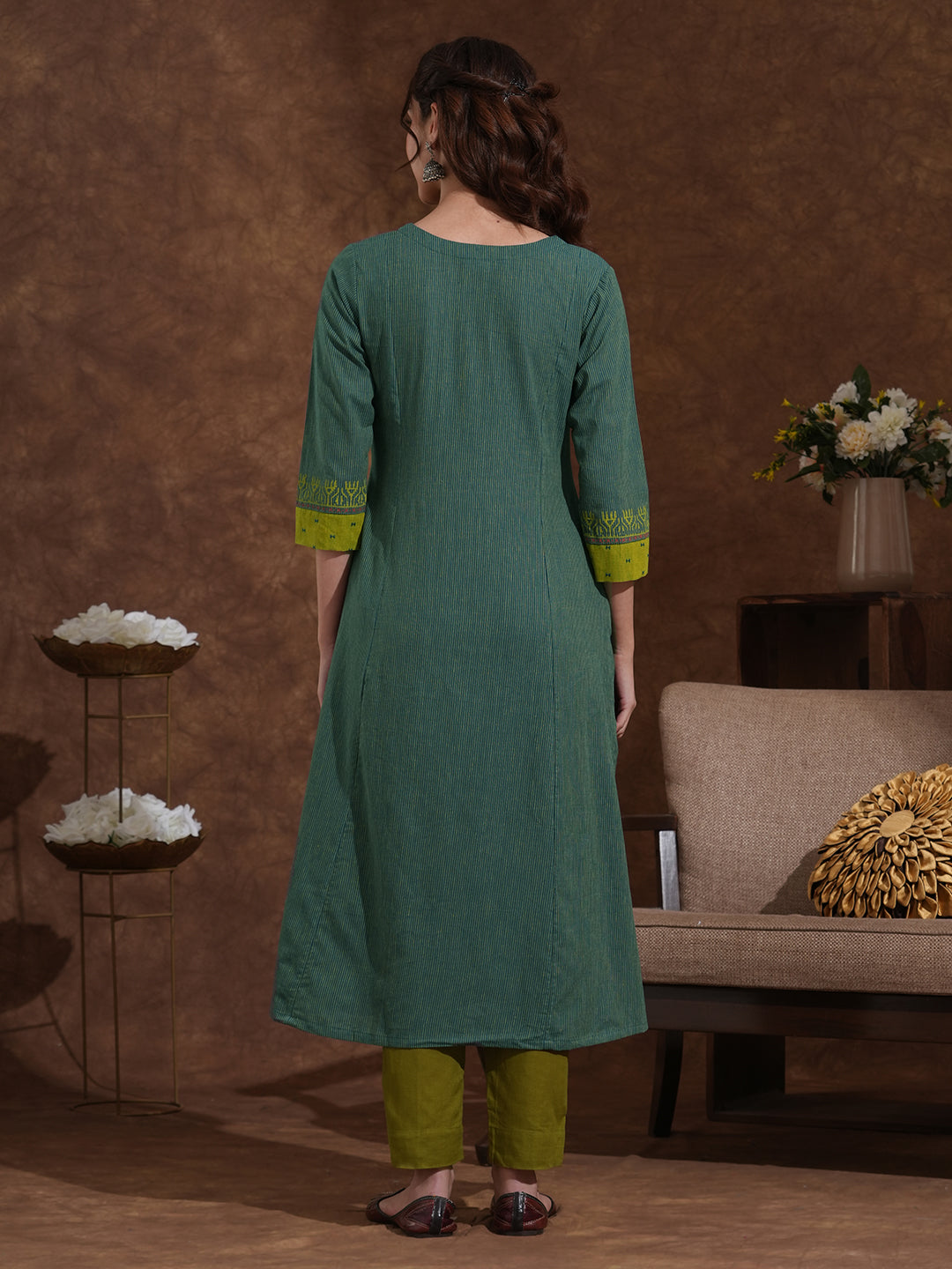 Pocketed A-line kurta in woven stripe cotton with a dobby trim and handwork detailing.