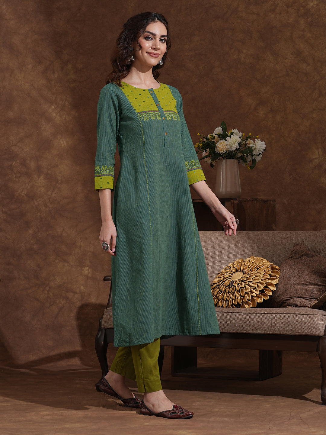 Pocketed A-line kurta in woven stripe cotton with a dobby trim and handwork detailing.