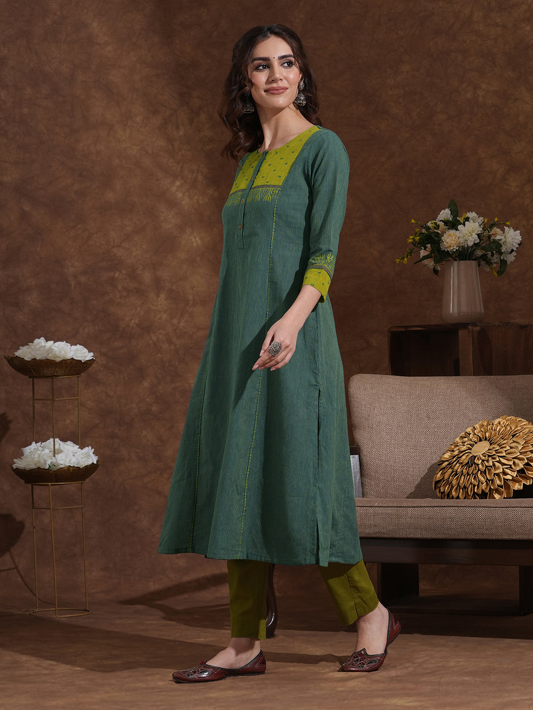 Pocketed A-line kurta in woven stripe cotton with a dobby trim and handwork detailing.