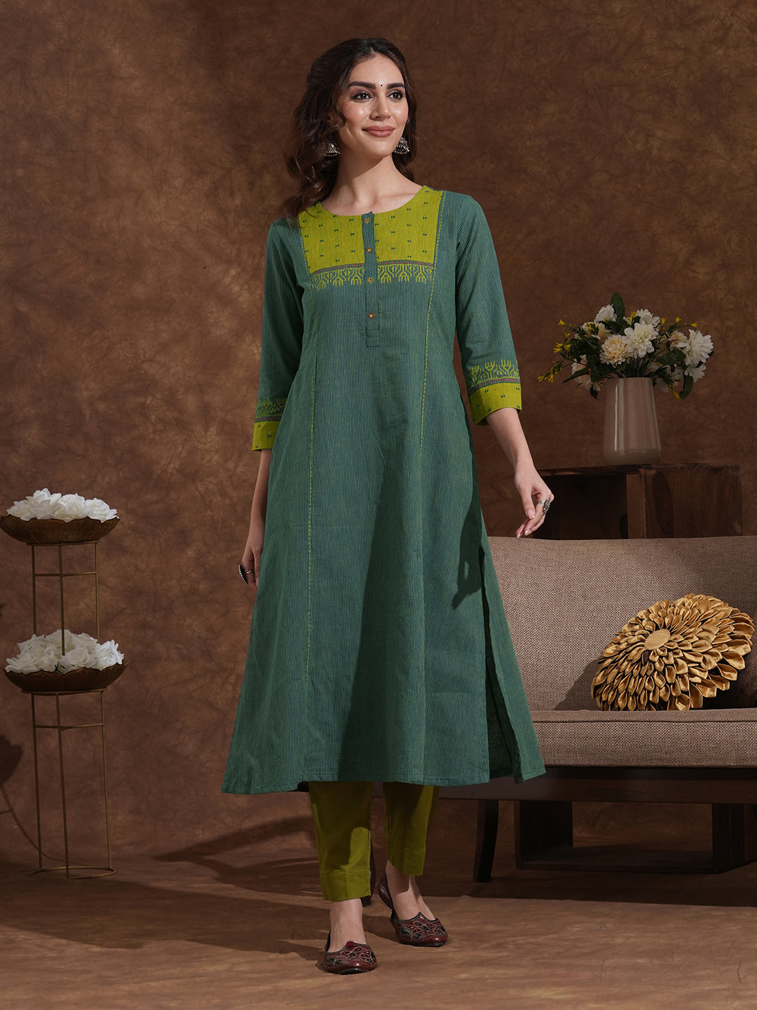 Pocketed A-line kurta in woven stripe cotton with a dobby trim and handwork detailing.