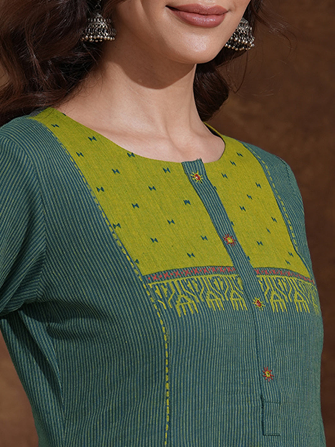 Pocketed A-line kurta in woven stripe cotton with a dobby trim and handwork detailing.