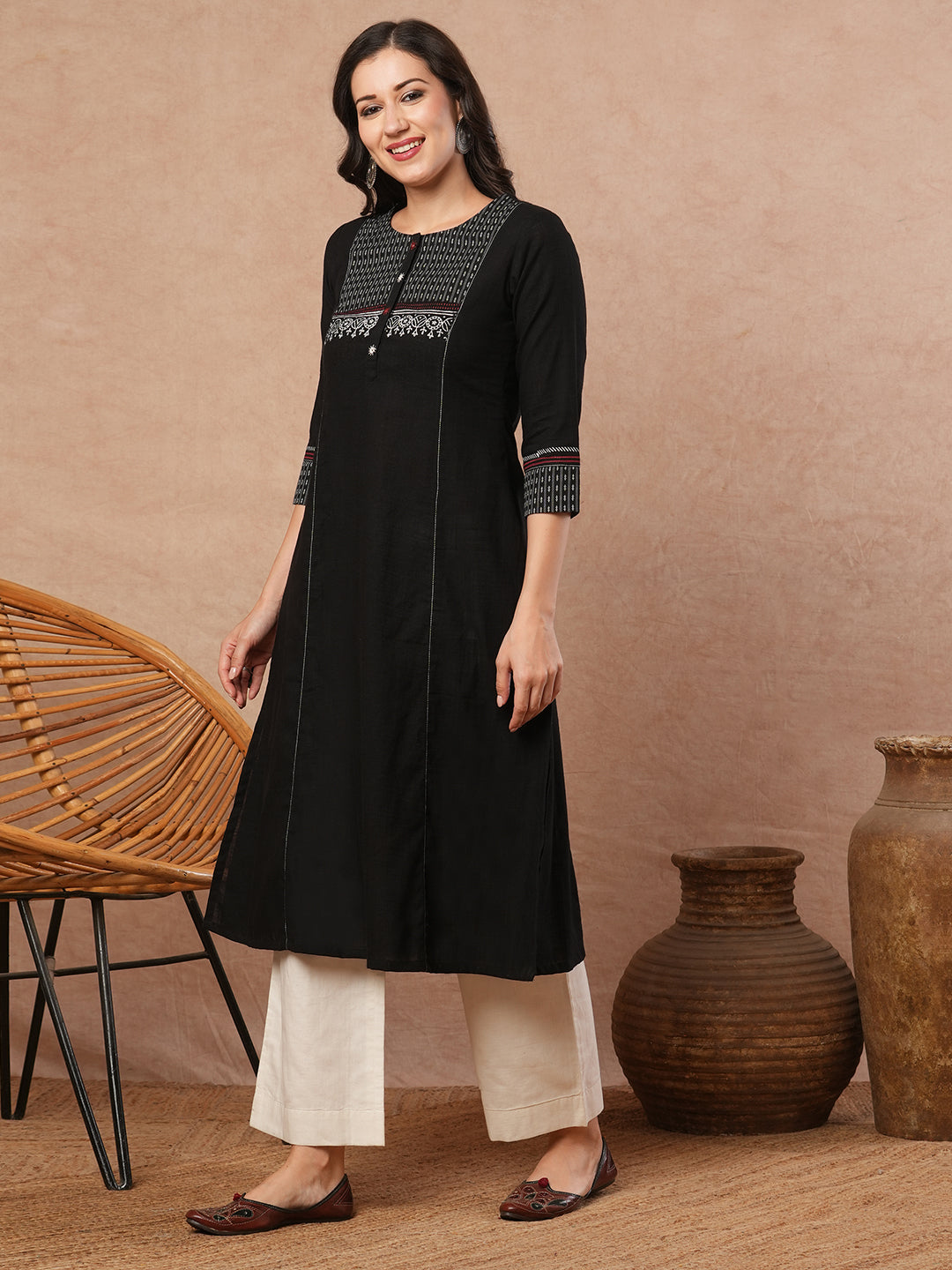 Pocketed A-line kurta in cotton slurb fabric with block print and handwork detailing.