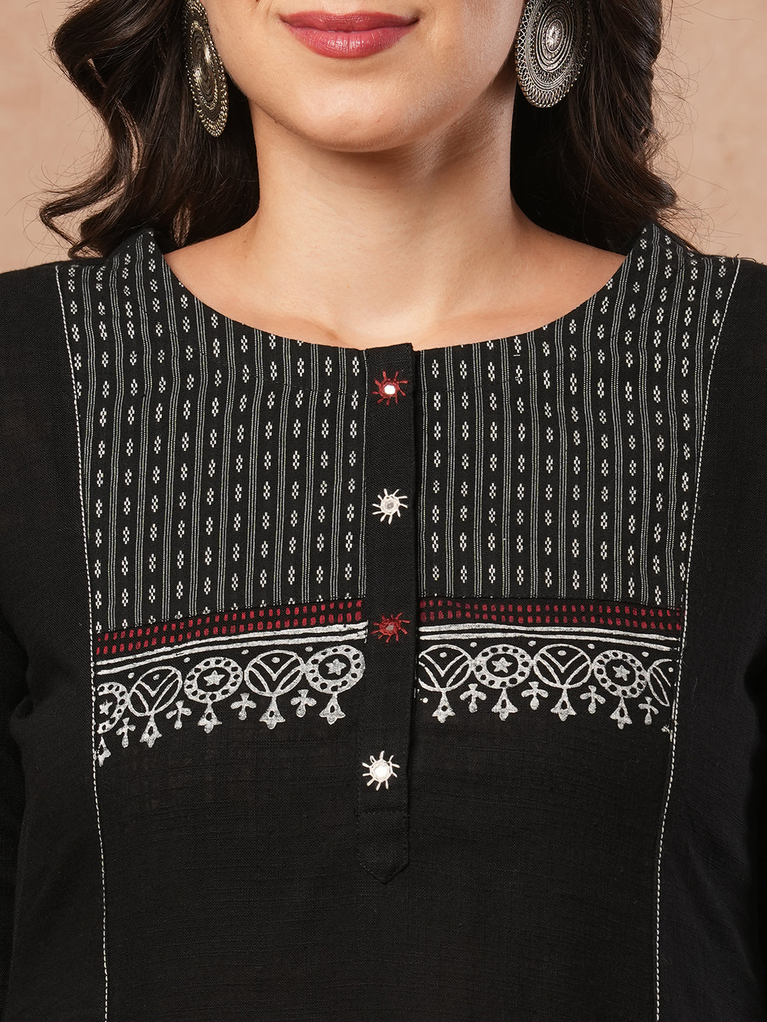 Pocketed A-line kurta in cotton slurb fabric with block print and handwork detailing.