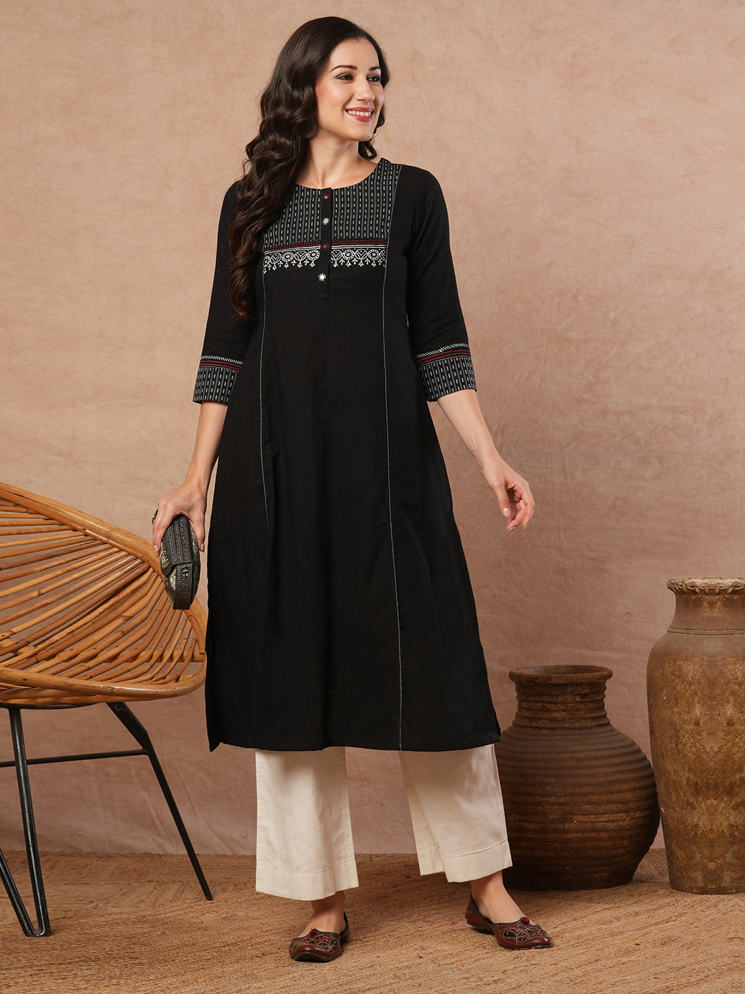 Pocketed A-line kurta in cotton slurb fabric with block print and handwork detailing.