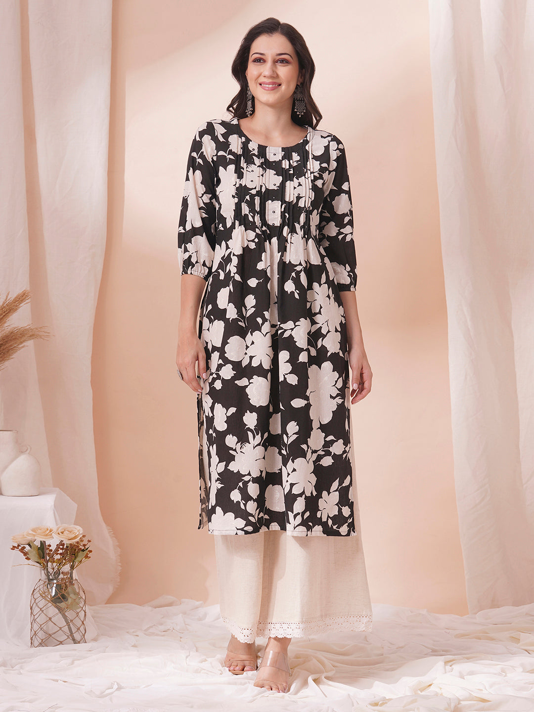 Straight printed kurta with tucks in front with handwork mirrors and elasticated sleeves.