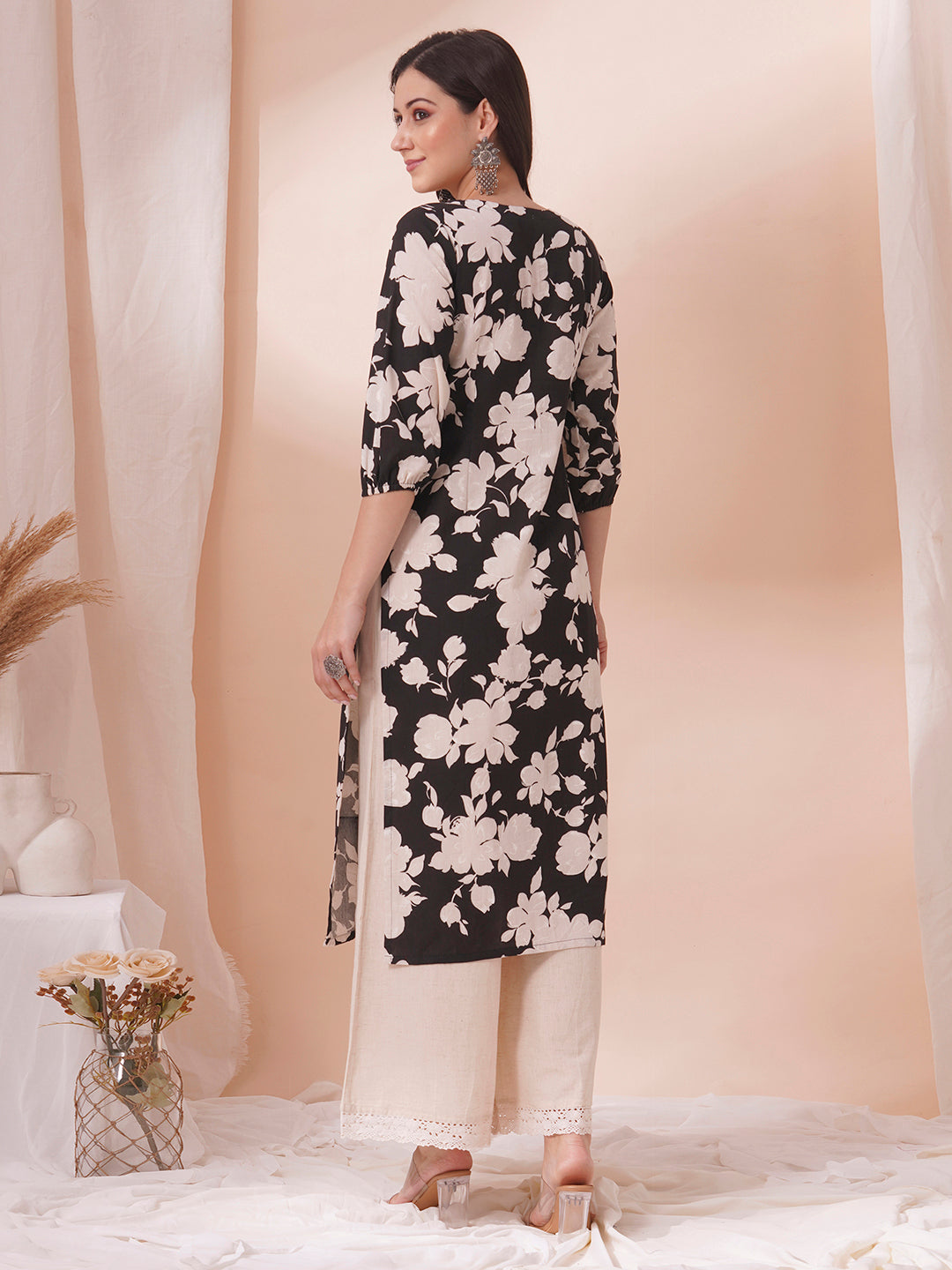 Straight printed kurta with tucks in front with handwork mirrors and elasticated sleeves.