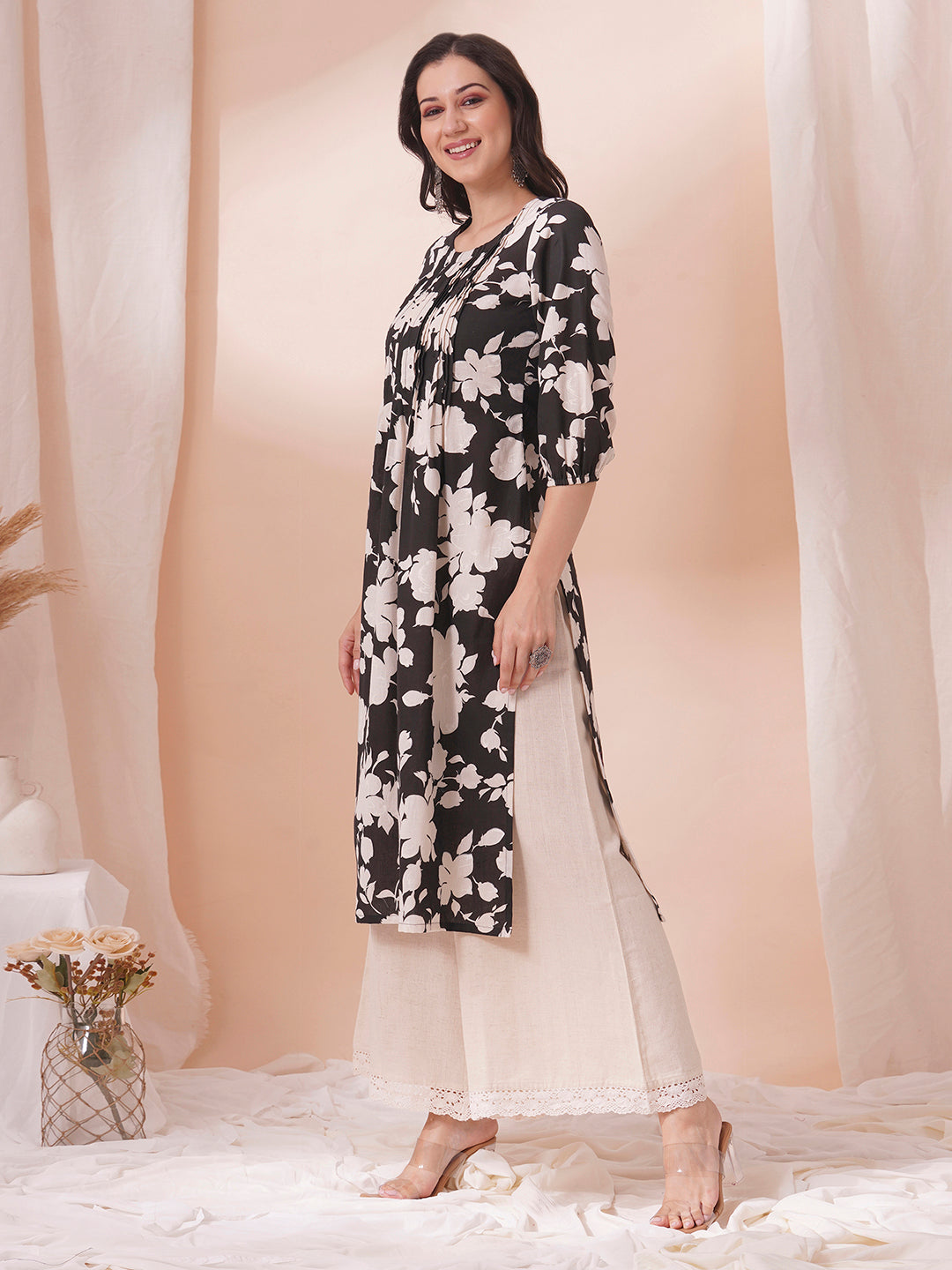 Straight printed kurta with tucks in front with handwork mirrors and elasticated sleeves.