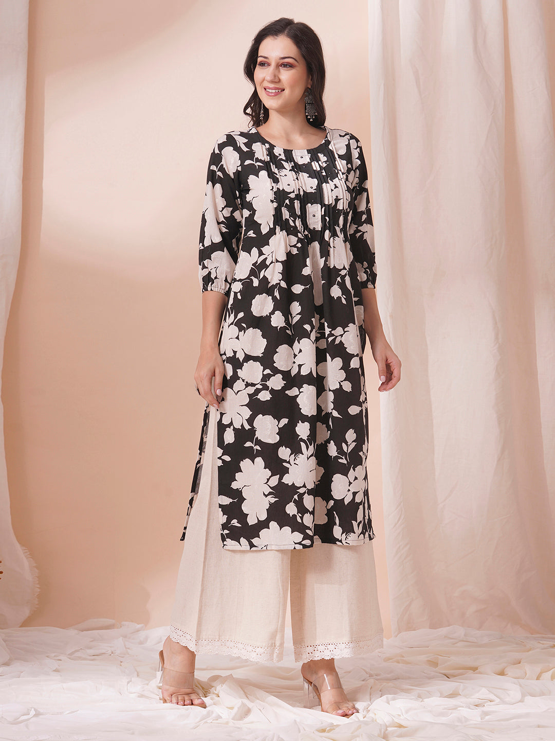 Straight printed kurta with tucks in front with handwork mirrors and elasticated sleeves.