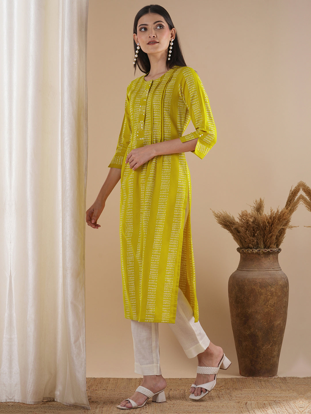 Straight fit kurta with a broad mirror work placket and tucks between stripes and broad sleeve cuff