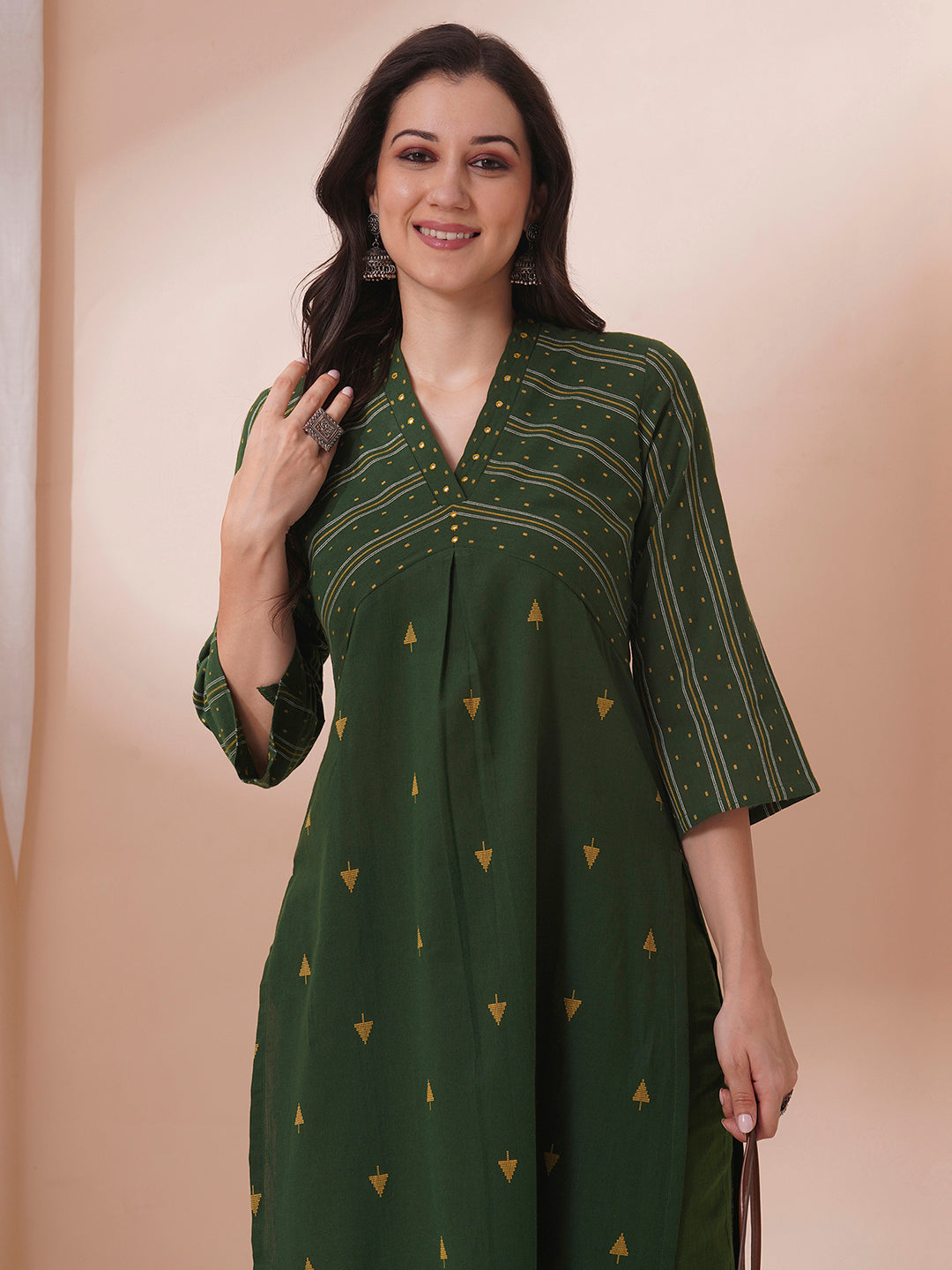 A centre pleated straight fit kurta in complimenting dobby fabric with mirror work.