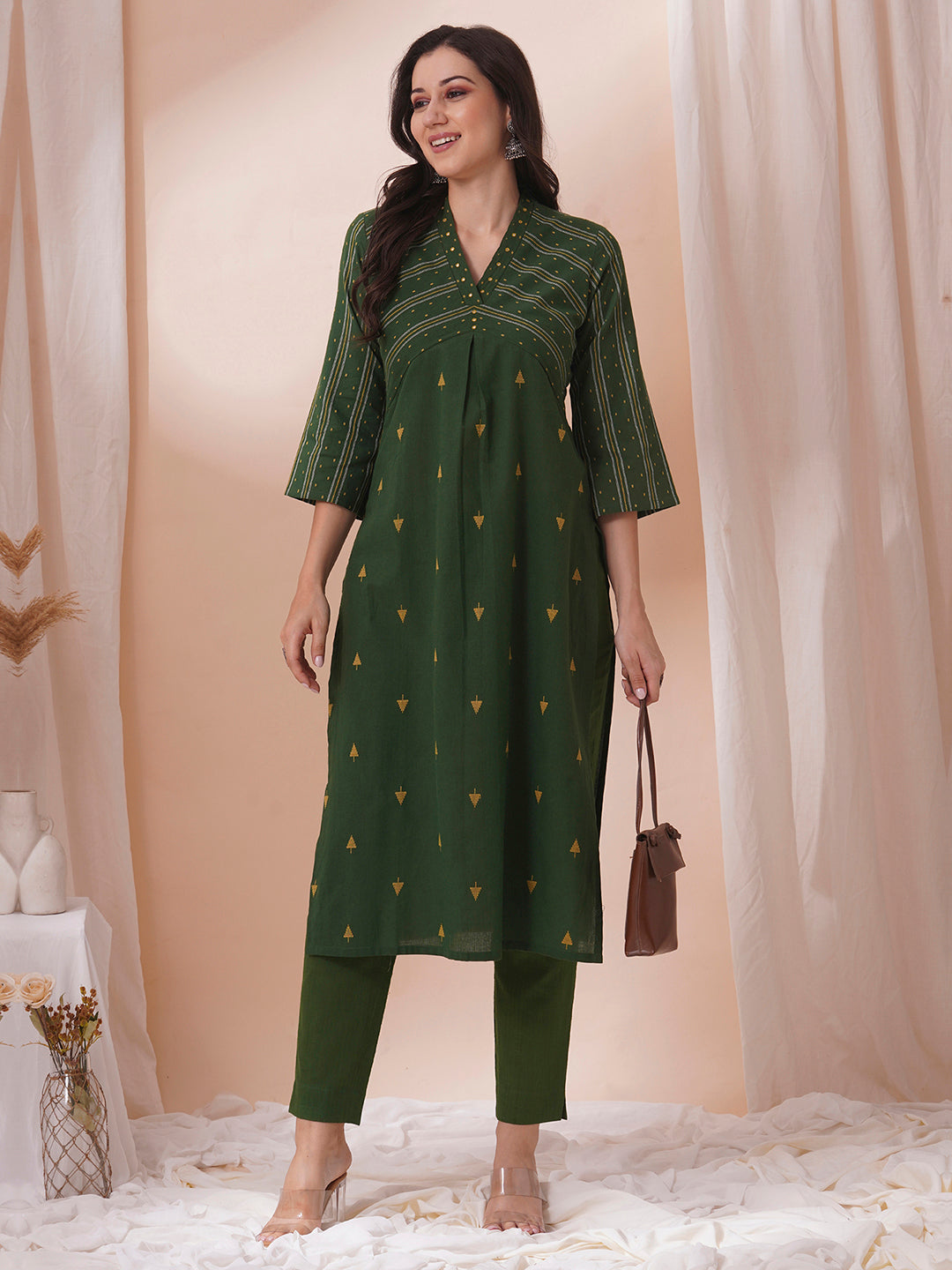 A centre pleated straight fit kurta in complimenting dobby fabric with mirror work.