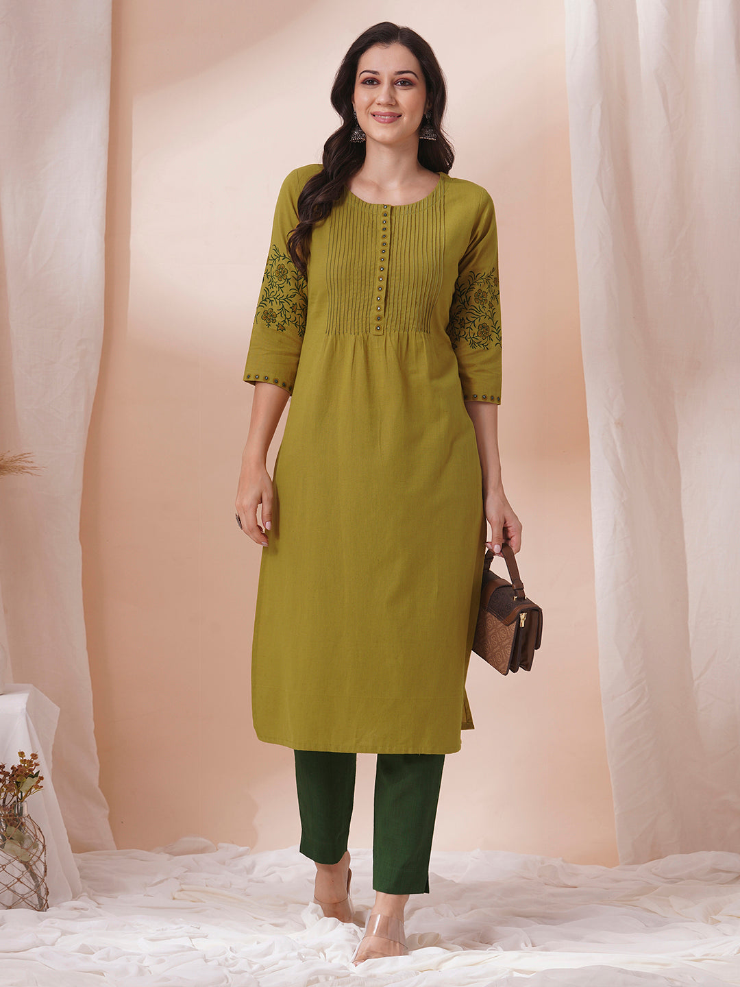 Straight fit kurta with pintucks and block printed sleeves and placket highlighted with mirrors.