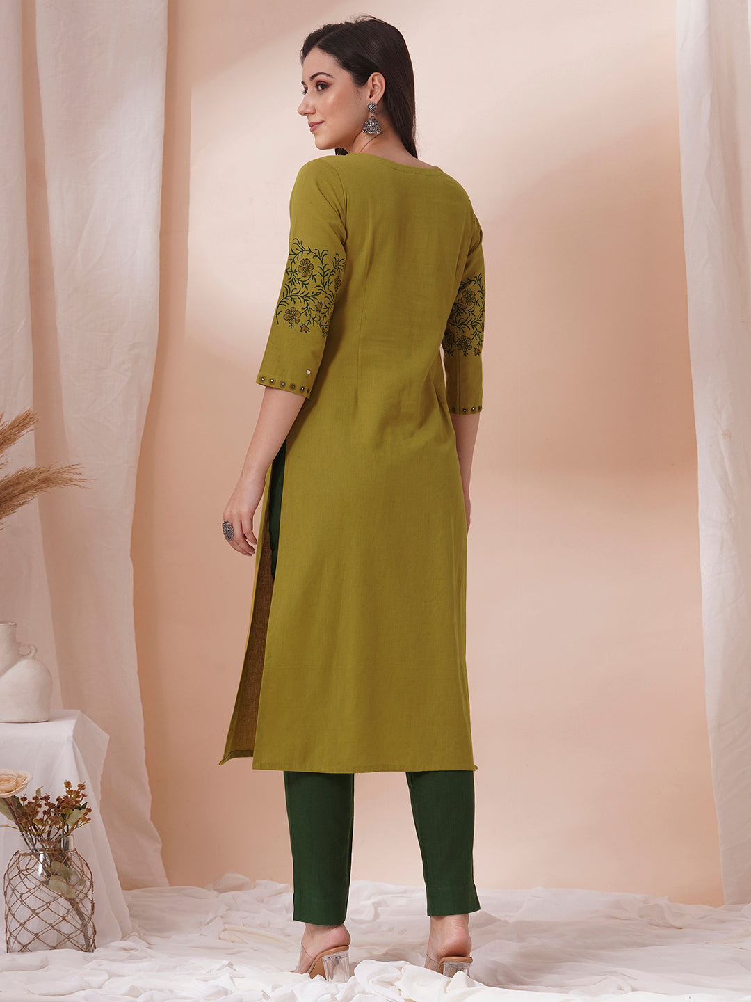 Straight fit kurta with pintucks and block printed sleeves and placket highlighted with mirrors.