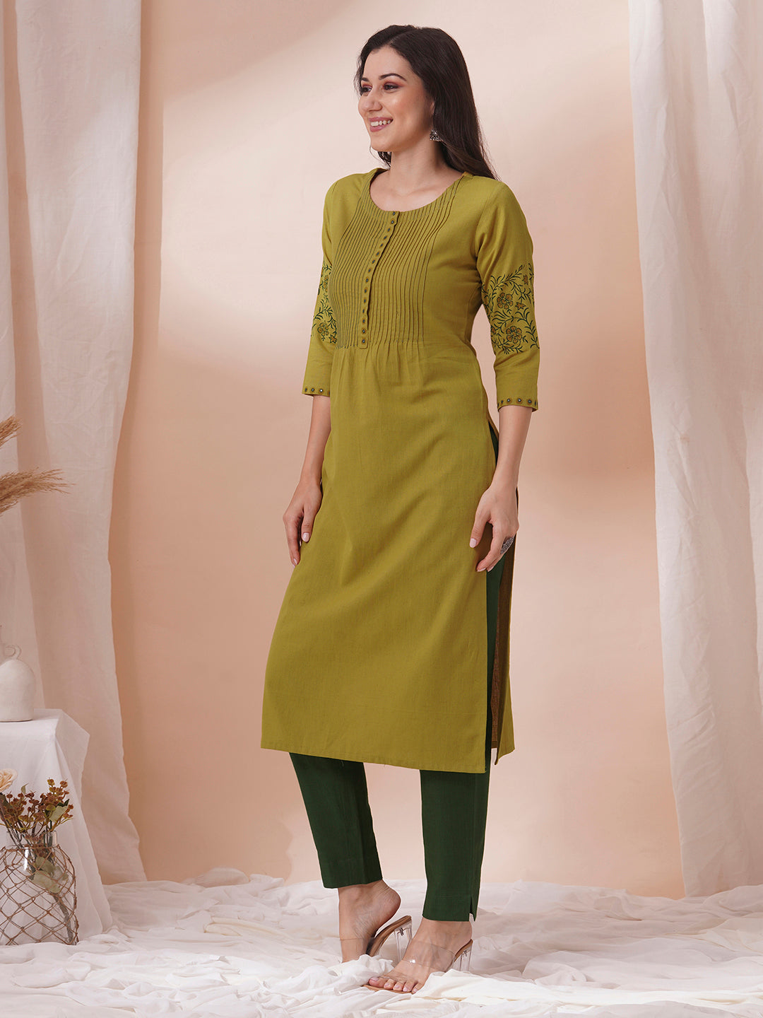 Straight fit kurta with pintucks and block printed sleeves and placket highlighted with mirrors.