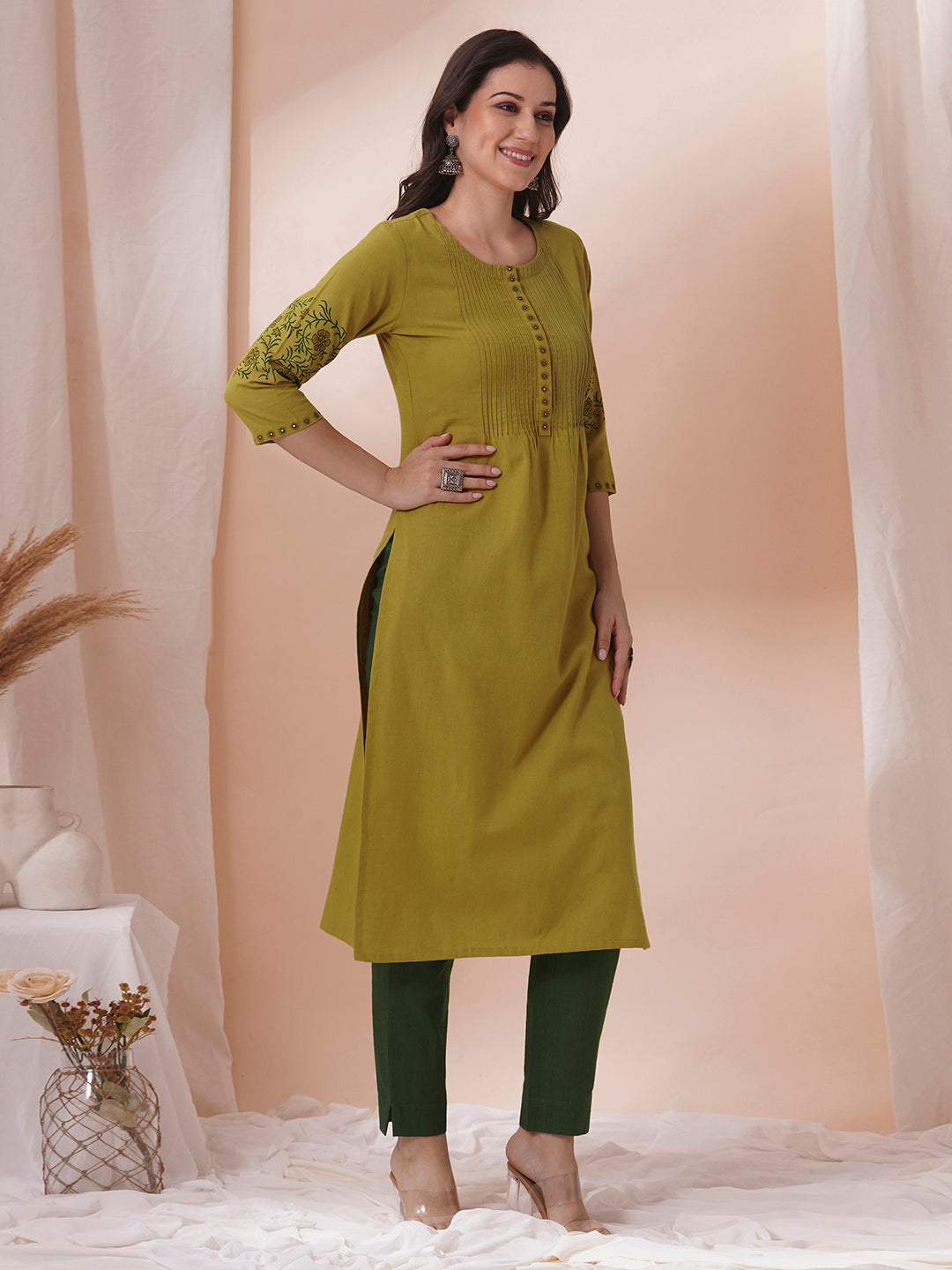 Straight fit kurta with pintucks and block printed sleeves and placket highlighted with mirrors.