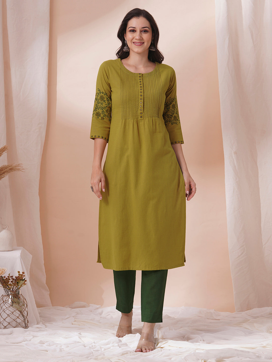 Straight fit kurta with pintucks and block printed sleeves and placket highlighted with mirrors.