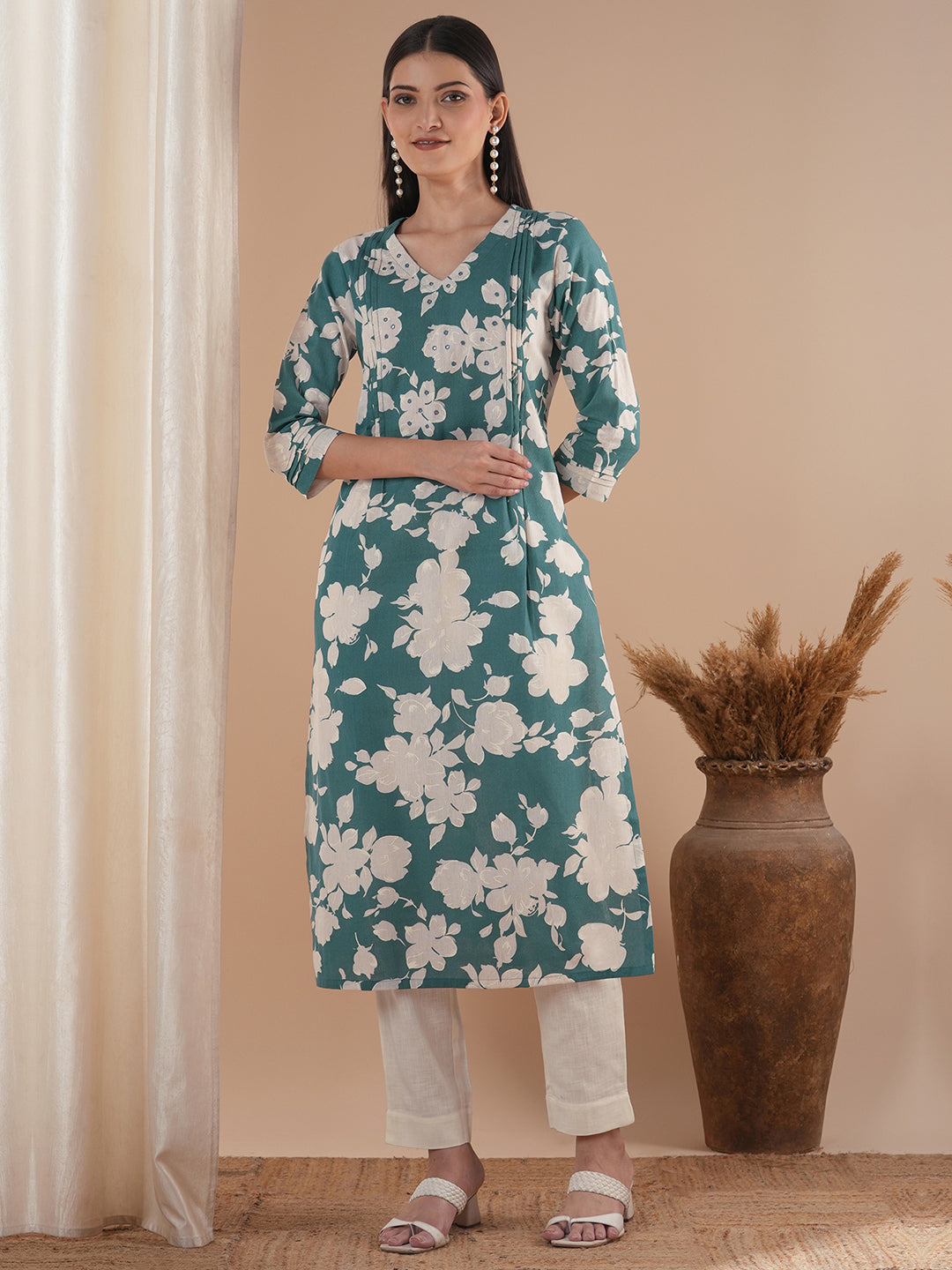 Straight floral printed kurta with tucks on the shoulder and sleeves