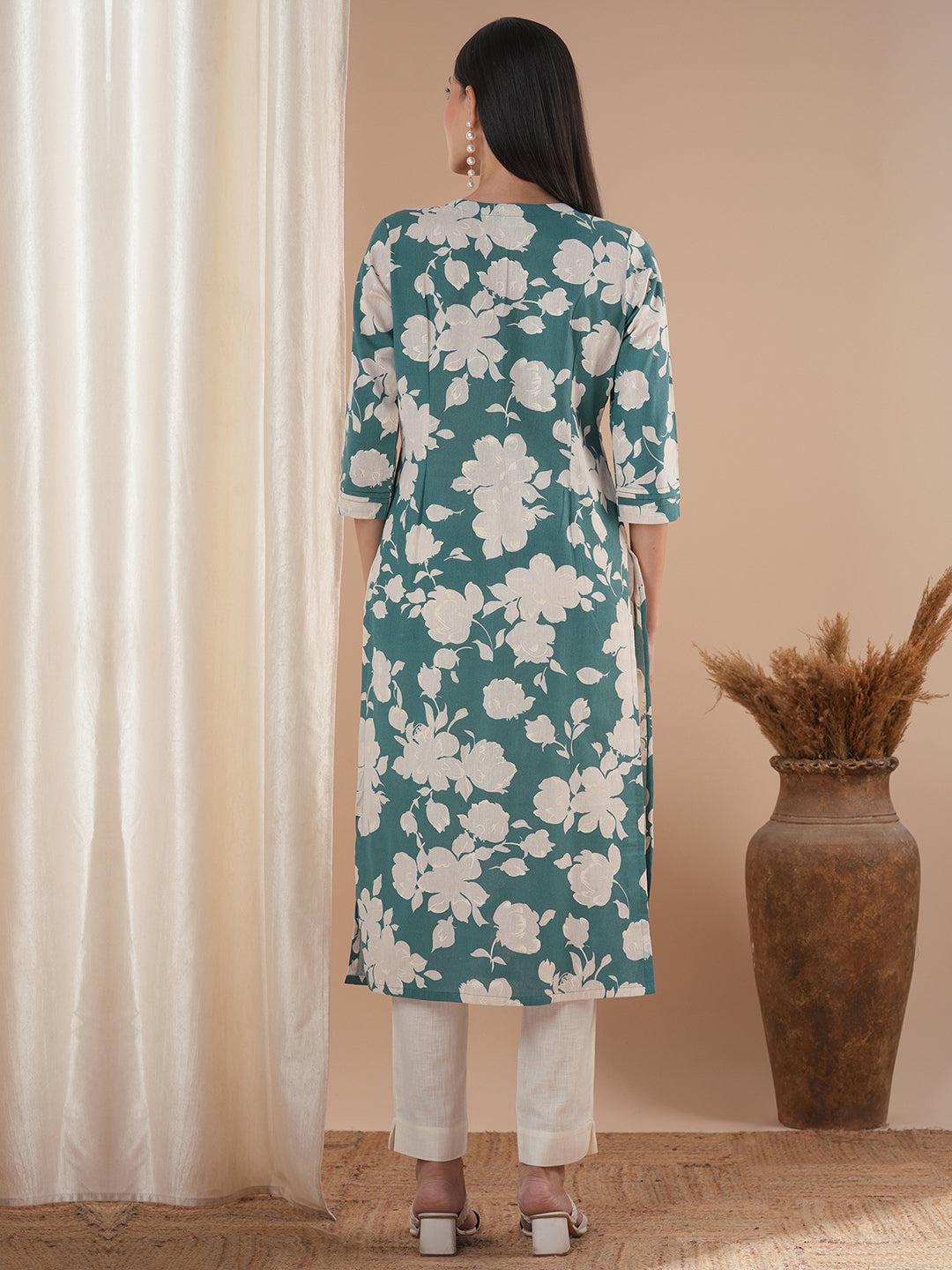 Straight floral printed kurta with tucks on the shoulder and sleeves