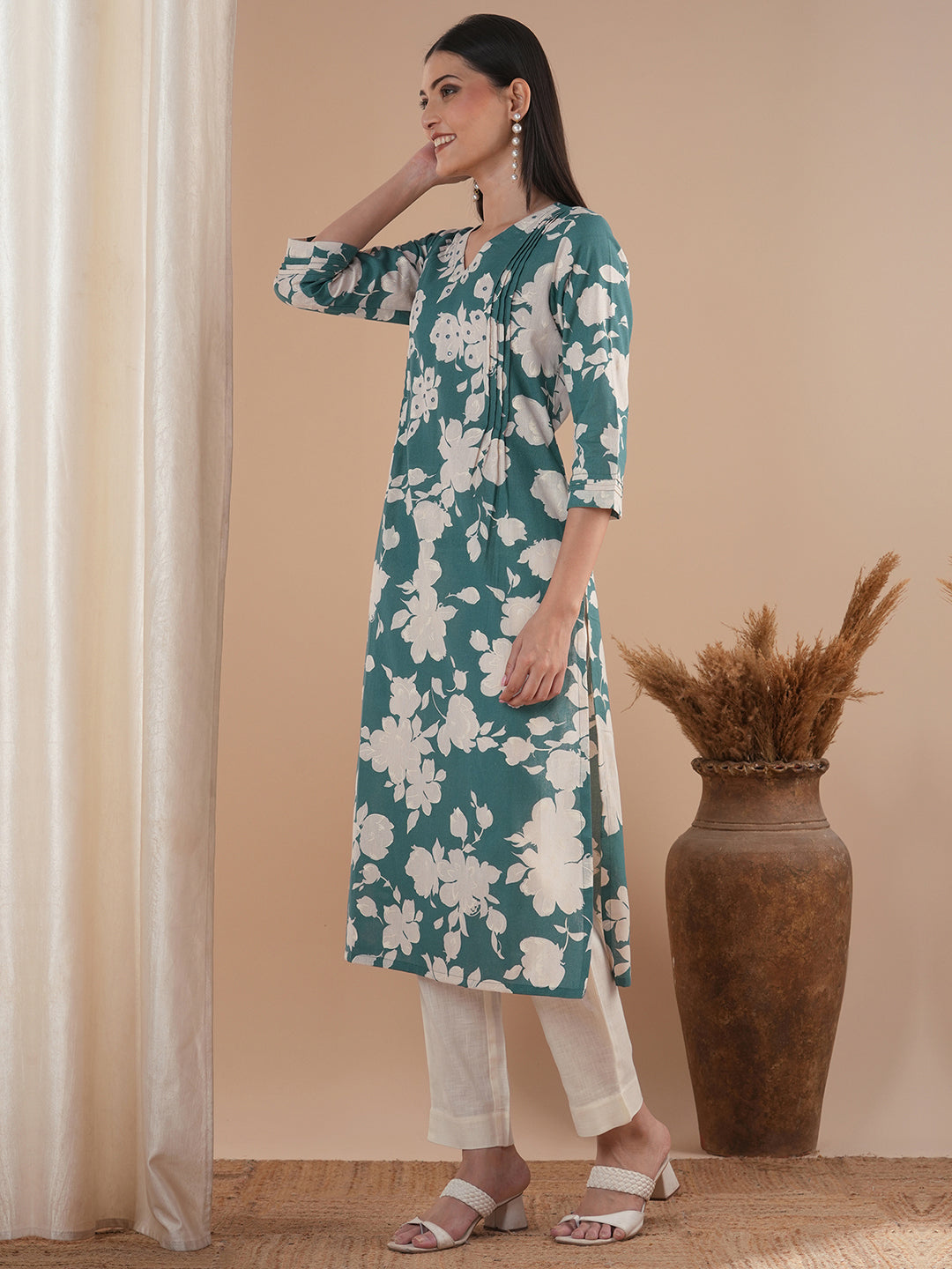 Straight floral printed kurta with tucks on the shoulder and sleeves