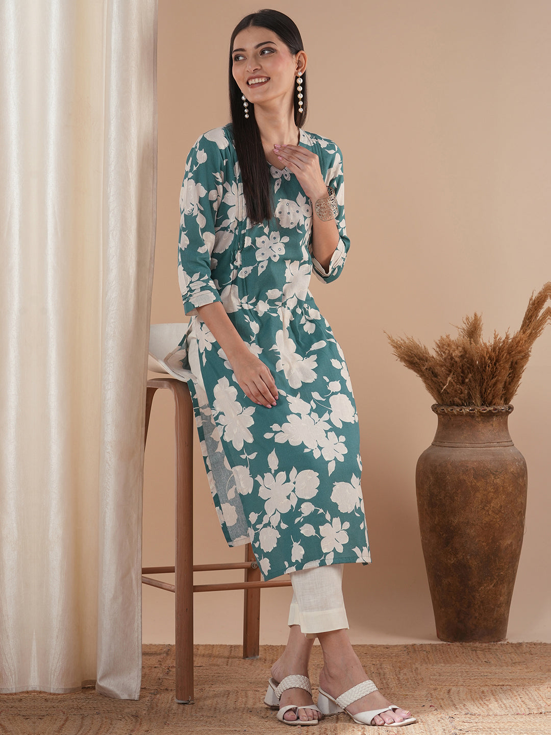 Straight floral printed kurta with tucks on the shoulder and sleeves