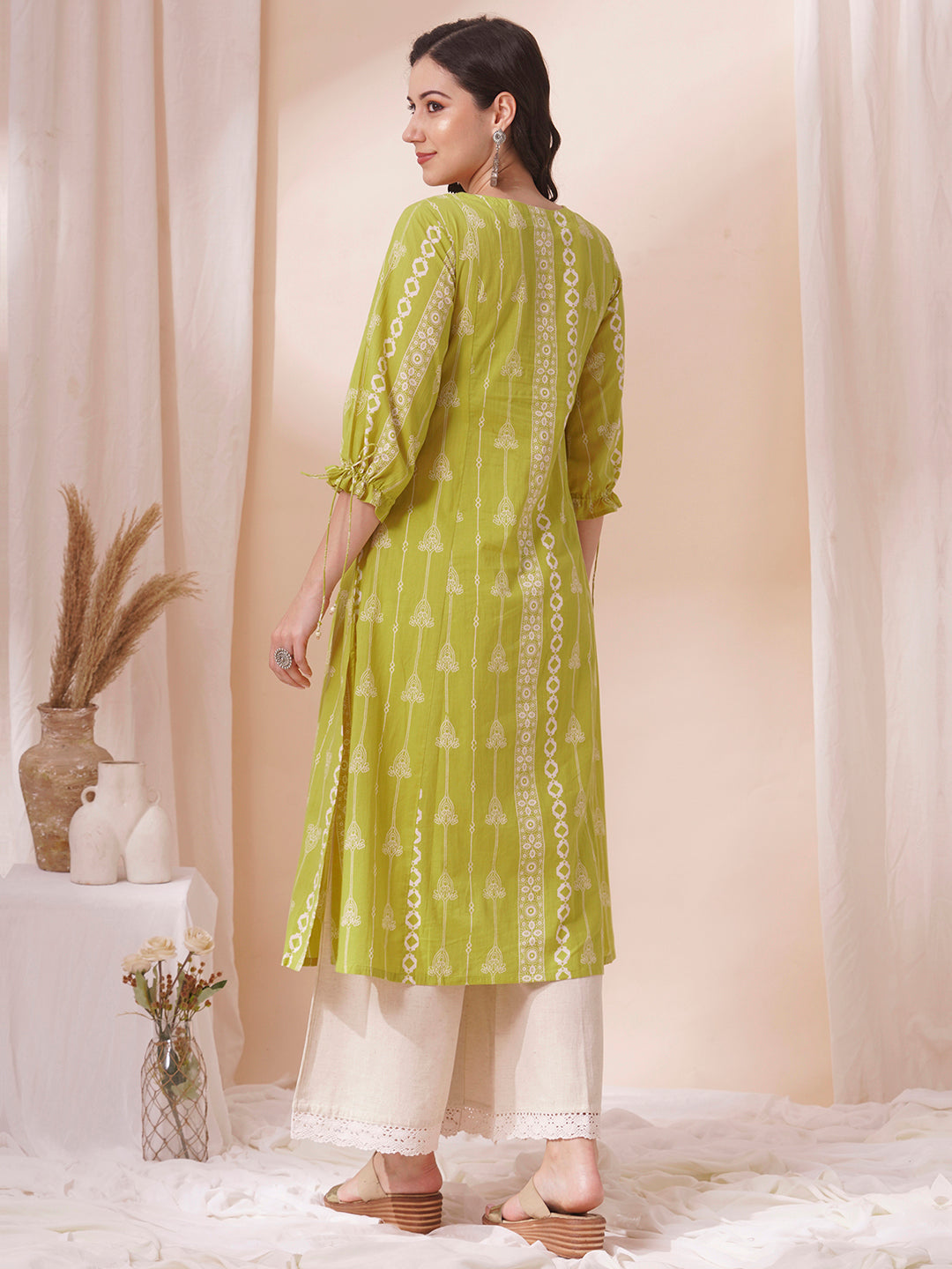 Shoulder princess A-line kurta with a horizontal stripe yoke with pintucks and mirrors.