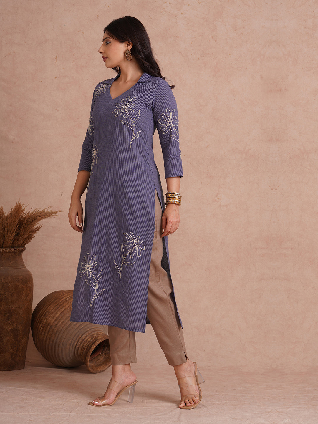 Straight fit collared kurta with placement cord work embroidery with hand sequins.