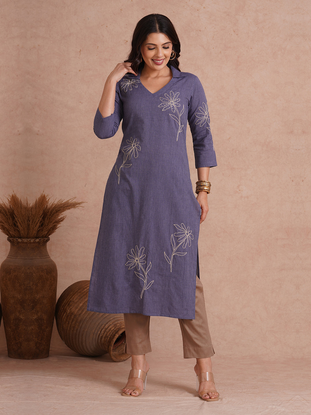 Straight fit collared kurta with placement cord work embroidery with hand sequins.