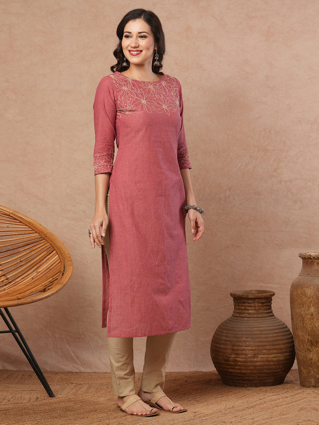 Straight fit kurta with cord work embroidery on the neckline and sleeve.