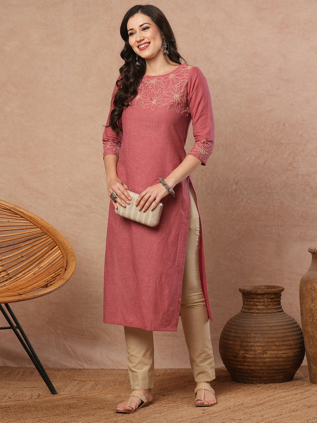 Straight fit kurta with cord work embroidery on the neckline and sleeve.