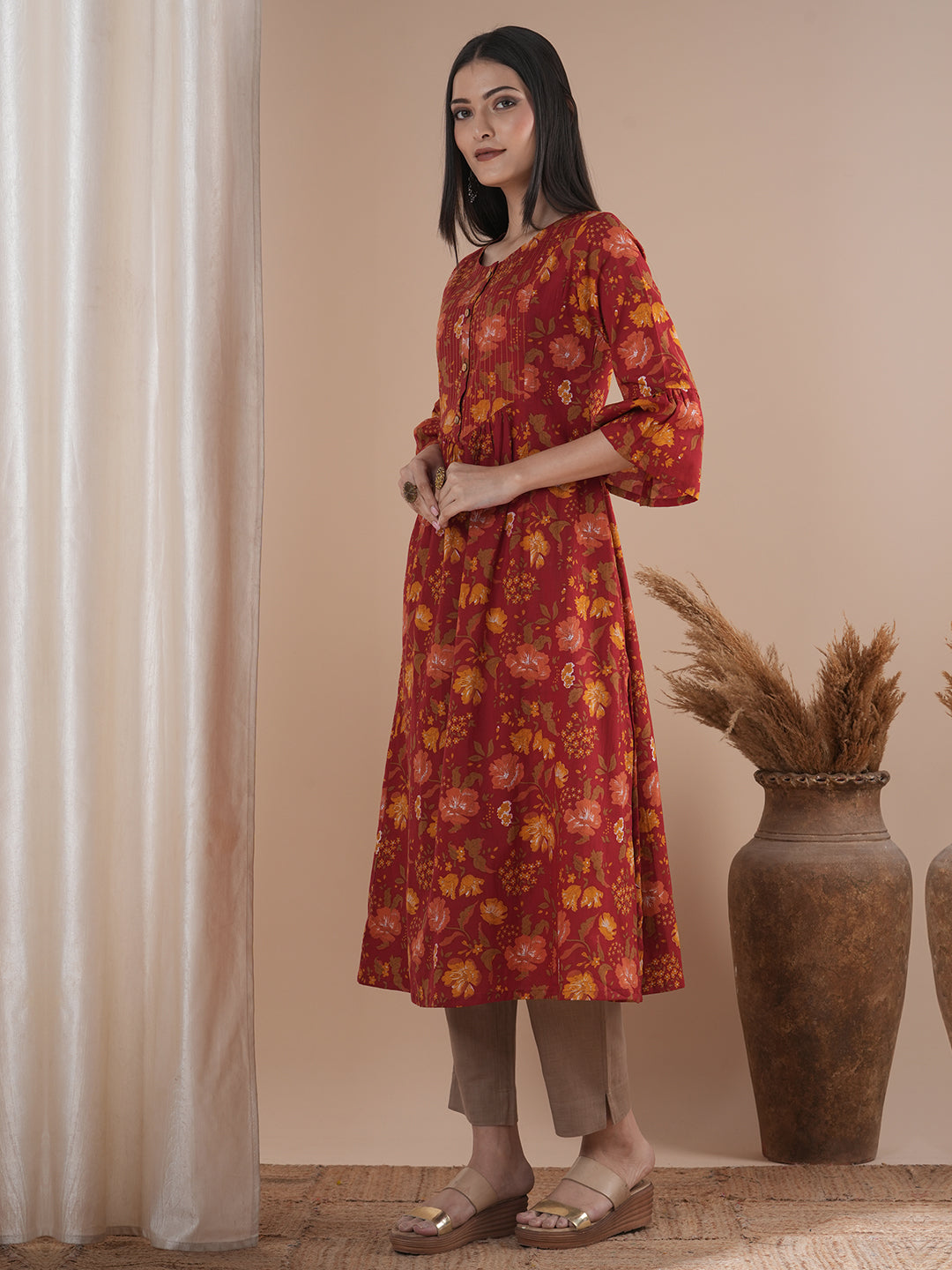 A printed shoulder princess A-line kurta with stitch lines on the shaped yoke and bell sleeves