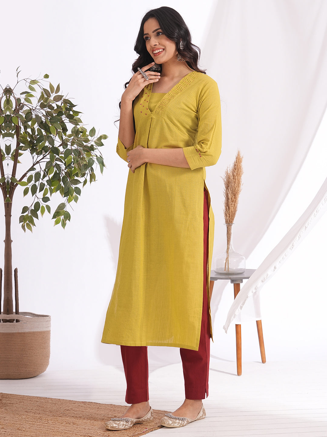 Straight fit kurta with smocking and mirrorwork neckline, shaped waistline with centre box pleat