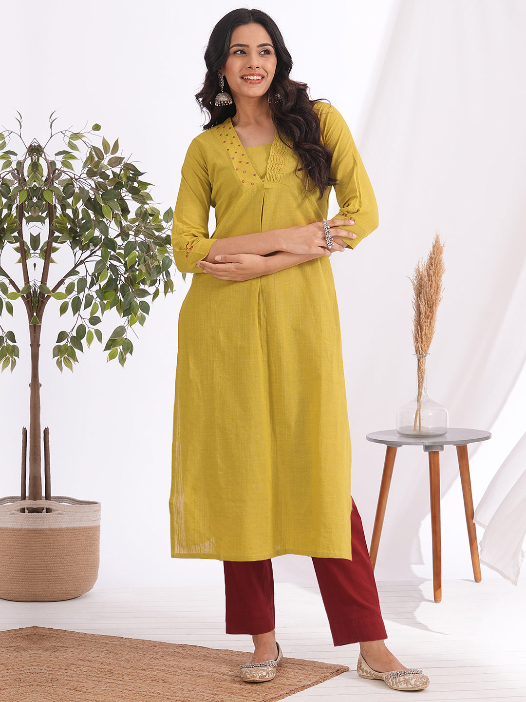 Straight fit kurta with smocking and mirrorwork neckline, shaped waistline with centre box pleat