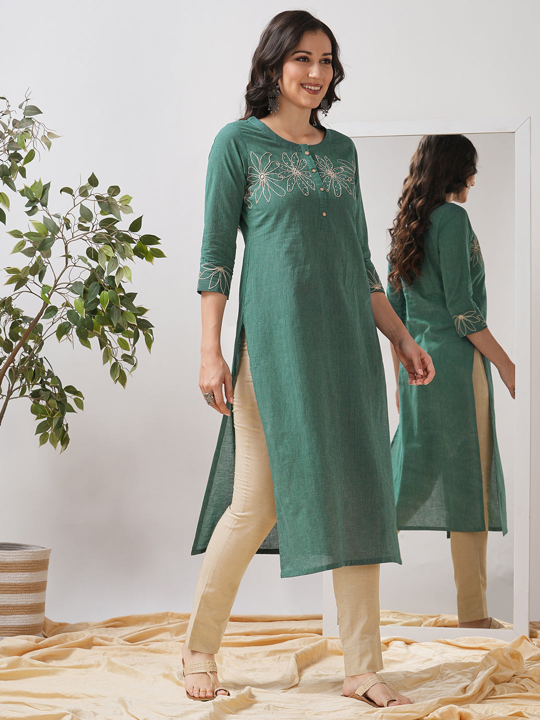 Straight fit kurta with cord work embroidery on the neck and cuff highlighted with sequins.