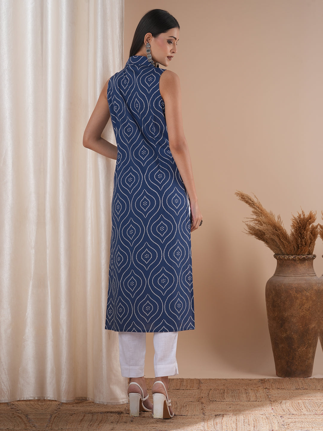 Straight sleeveless notch collared kurta with centre pleat and placket