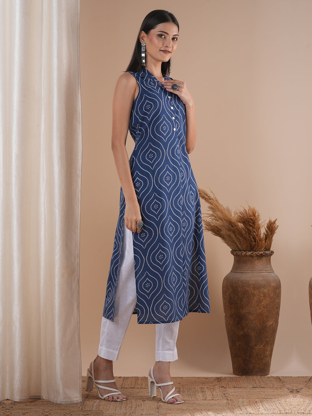 Straight sleeveless notch collared kurta with centre pleat and placket