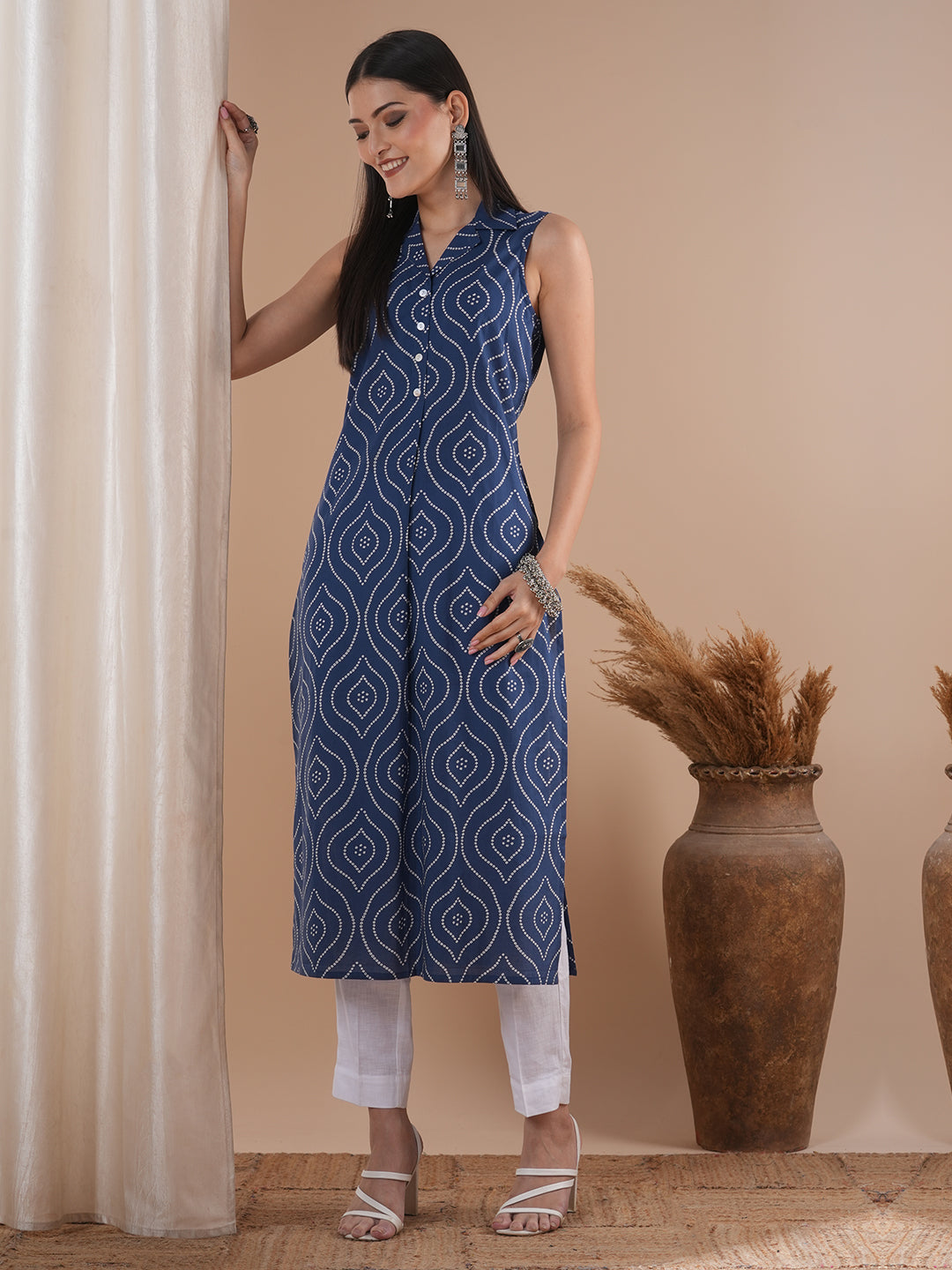 Straight sleeveless notch collared kurta with centre pleat and placket