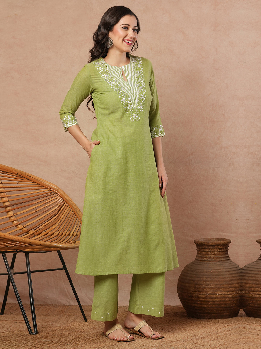 A-line kurta with cutwork embroidery neckline and sleeves and metered stripe yoke.