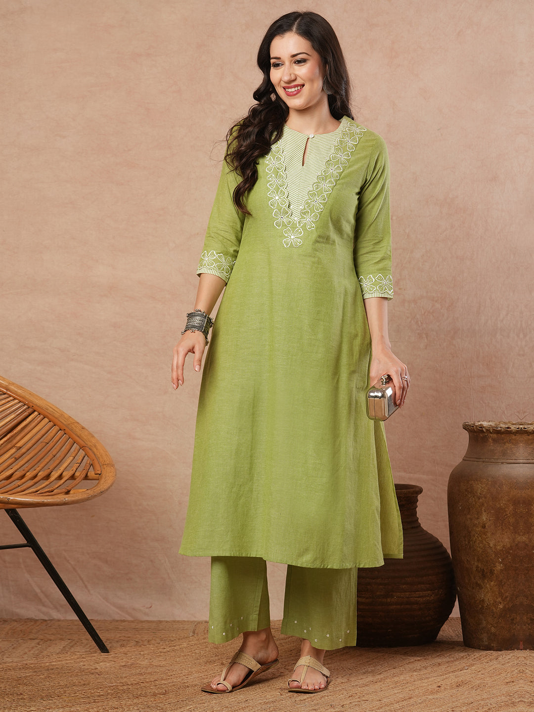 A-line kurta with cutwork embroidery neckline and sleeves and metered stripe yoke.