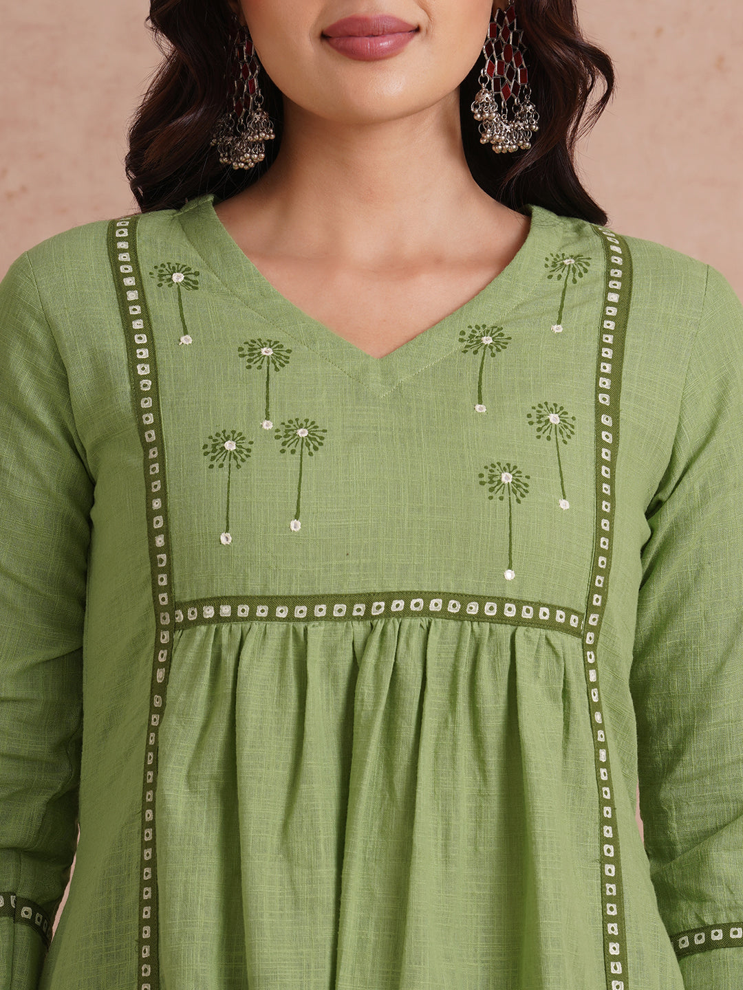 A-line kurta with contrast borders on seams and sleeves with block printed yoke.