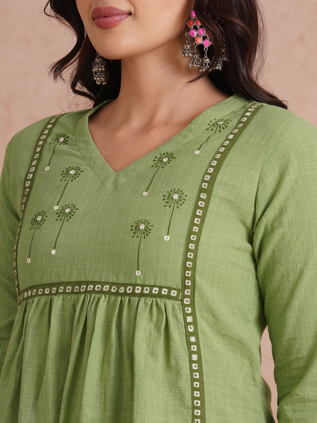 A-line kurta with contrast borders on seams and sleeves with block printed yoke.