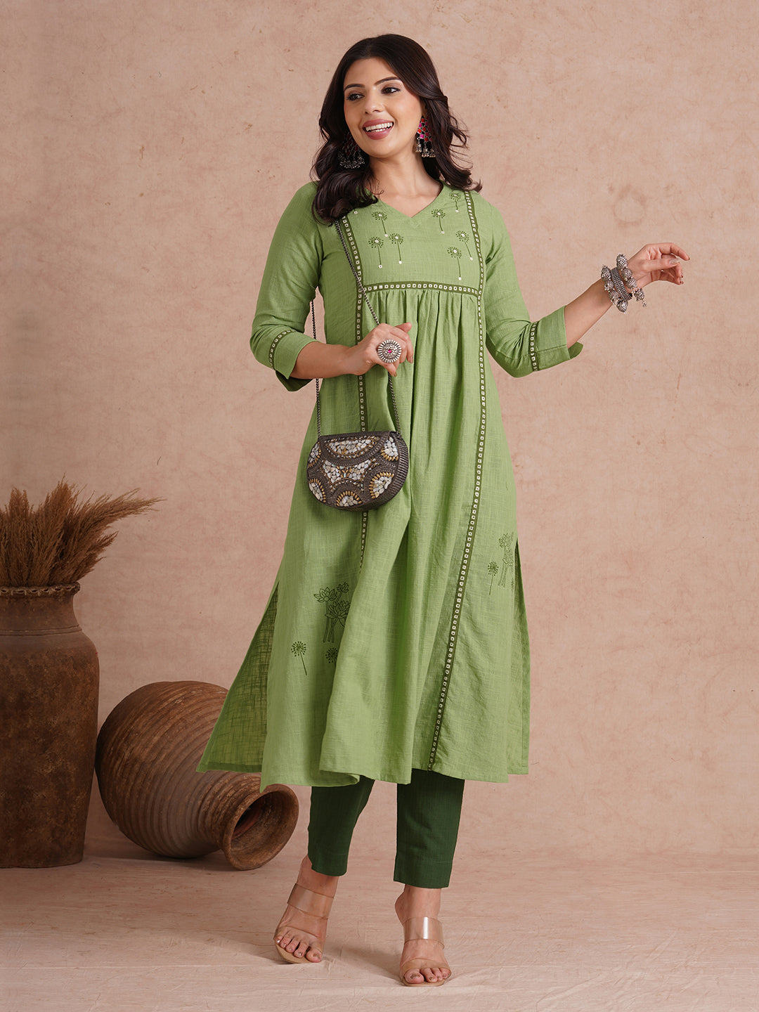 A-line kurta with contrast borders on seams and sleeves with block printed yoke.