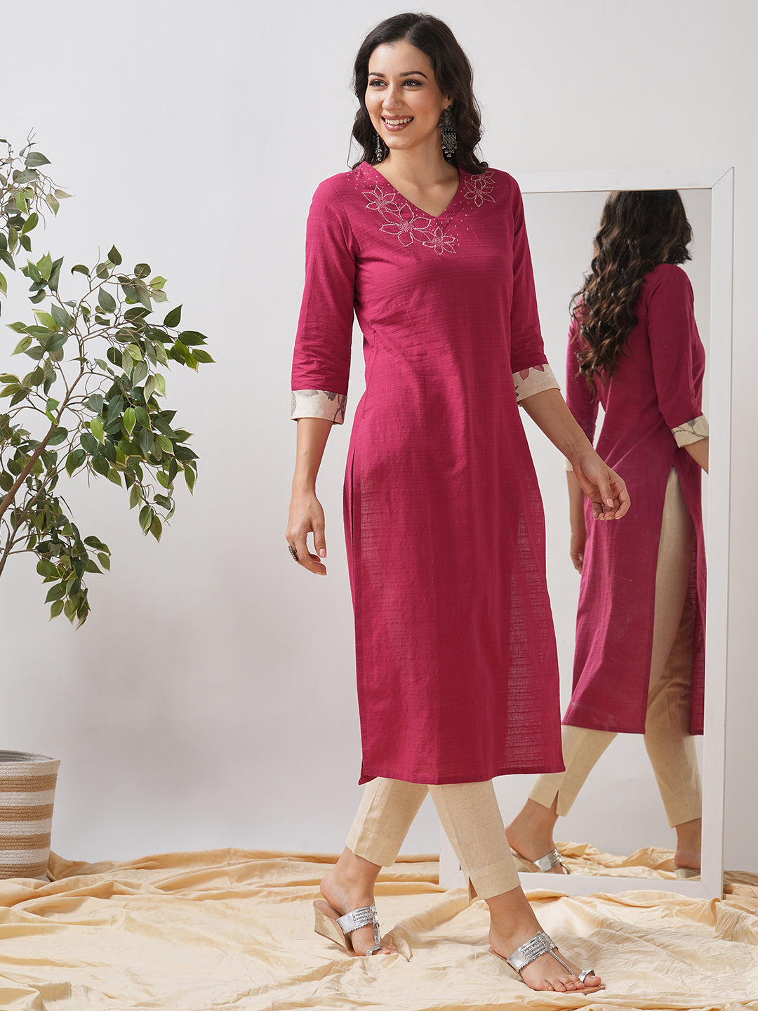 Straight fit kurta with embroidered neckline and contrast print roll-up cuff.