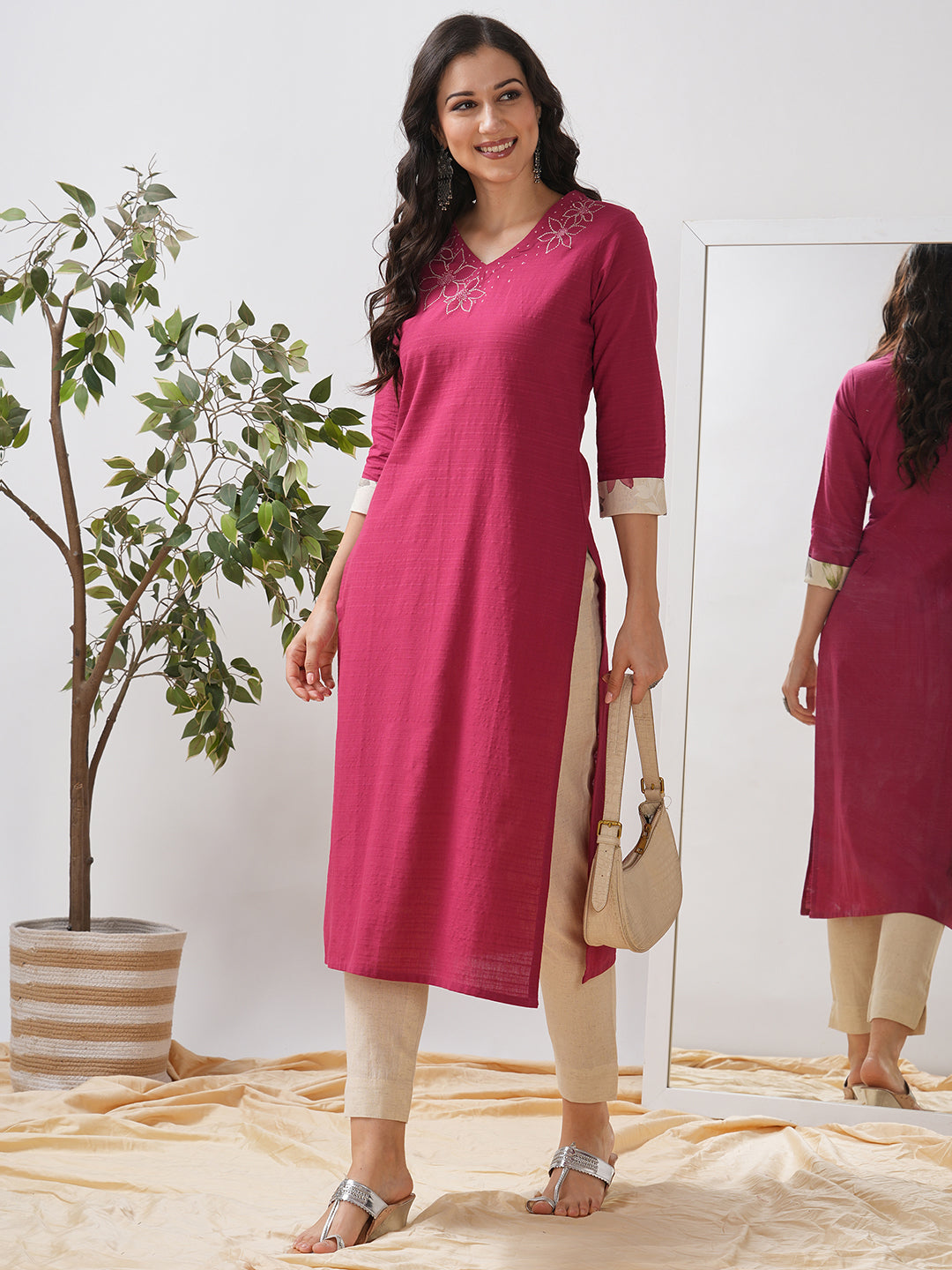 Straight fit kurta with embroidered neckline and contrast print roll-up cuff.