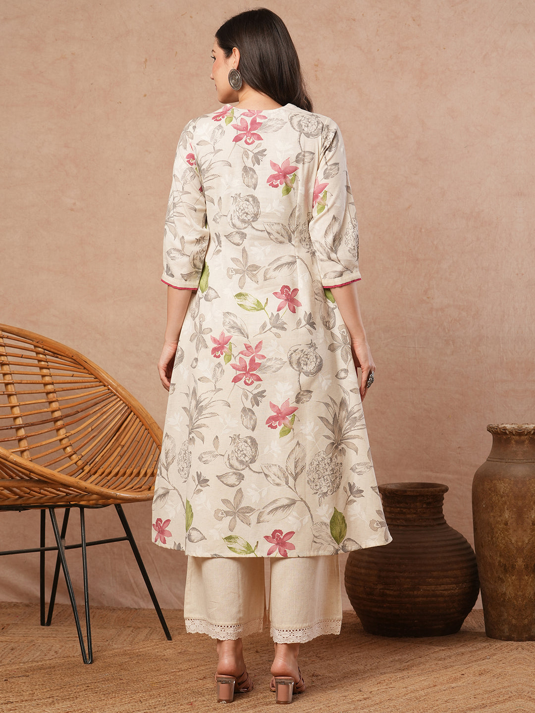 A-line printed kurta with embroidery and box pleated sleeves with contrast piping detailing.