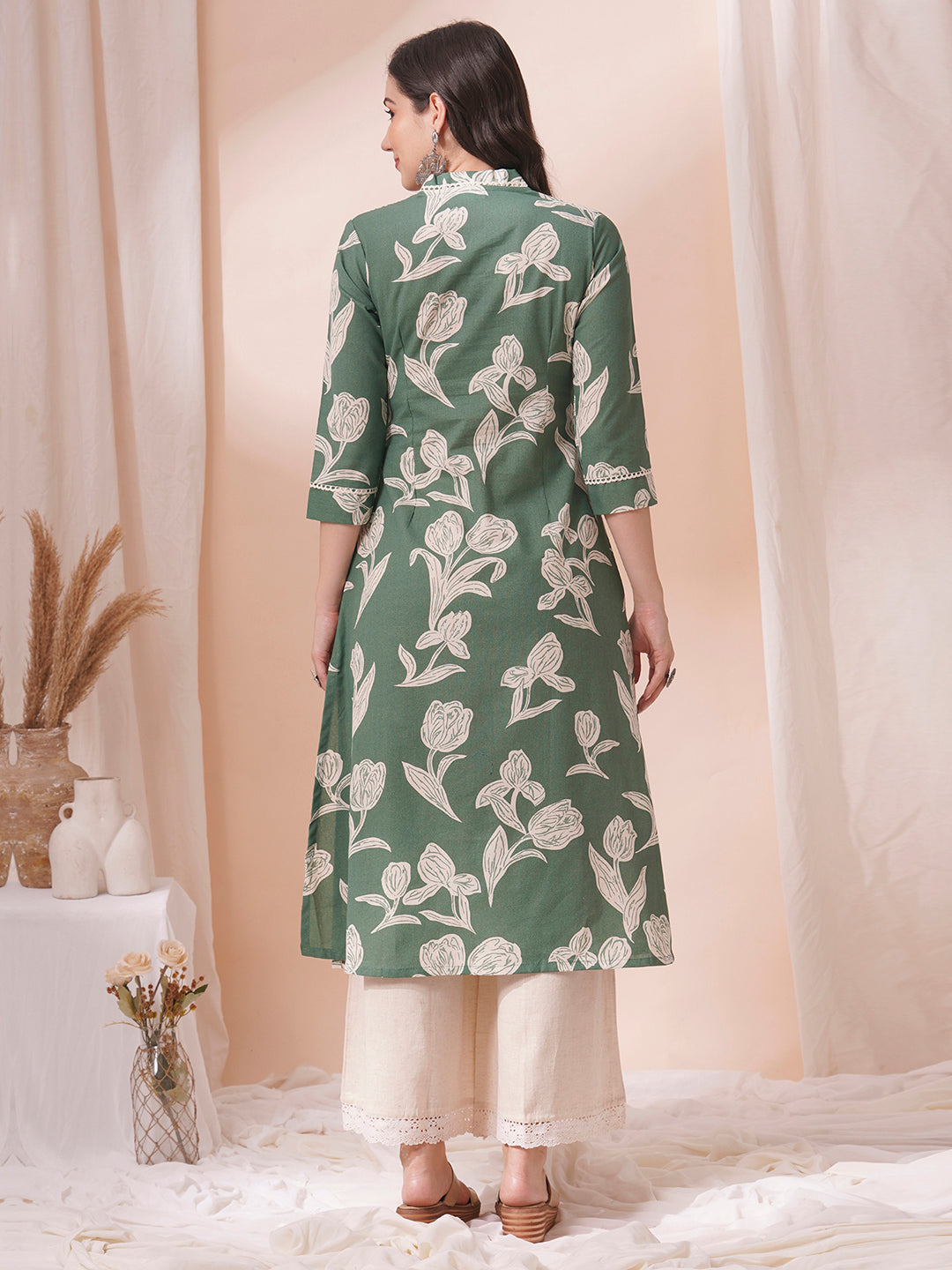 A flex printed A-line kurta with stitch line and lace detailing.