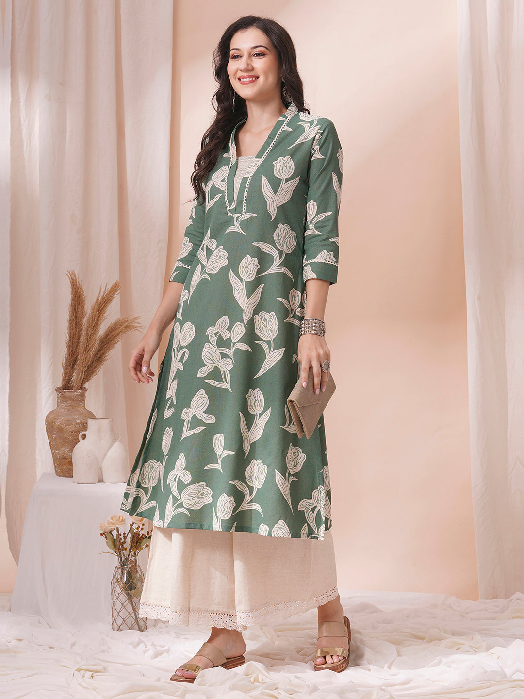 A flex printed A-line kurta with stitch line and lace detailing.