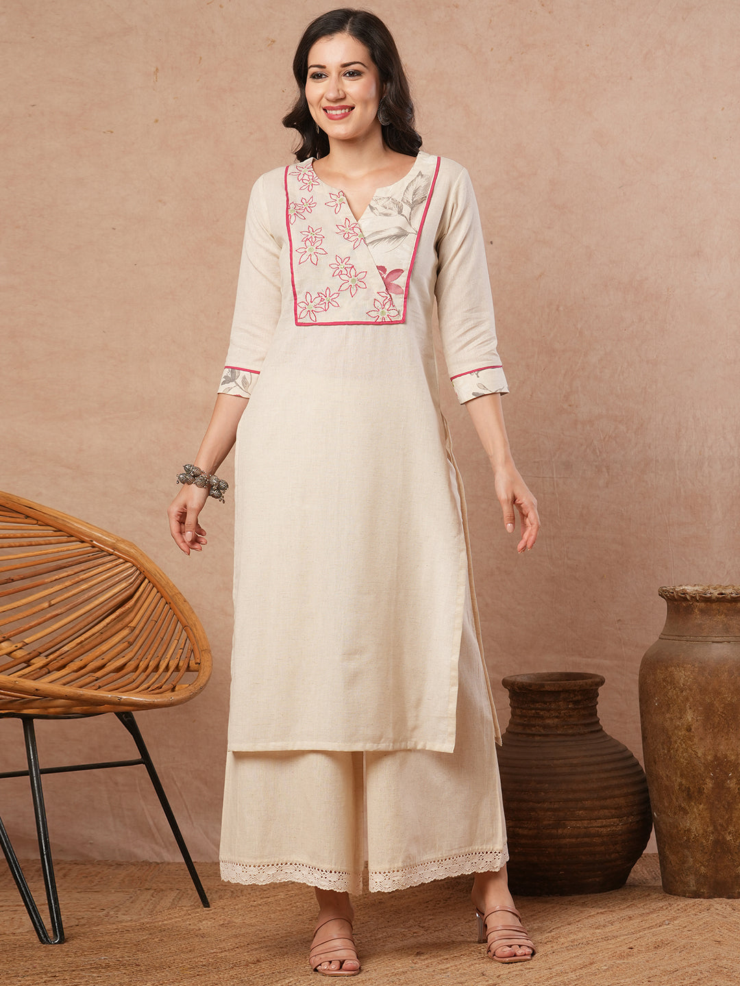 Straight fit solid kurta with a wrap half embroidered and half printed yoke.