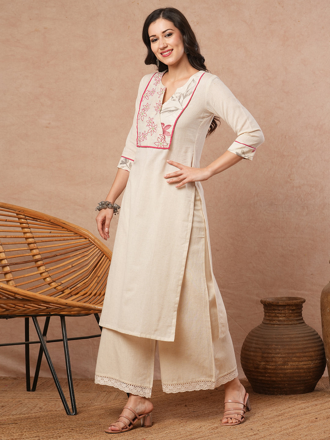 Straight fit solid kurta with a wrap half embroidered and half printed yoke.
